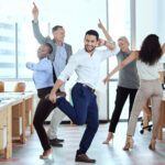 showing-off-his-moves-shot-of-a-group-of-business-2022-08-26-12-00-15-utc